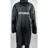 A VETEMENTS PARIS 'PRET A PORTER' RAIN JACKET 113cm x 60cm