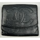 A CHANEL BLACK 'CAVIAR' LEATHER BI-FOLD PURSE WALLET, stamped within 'Made in Italy' and 'Chanel'