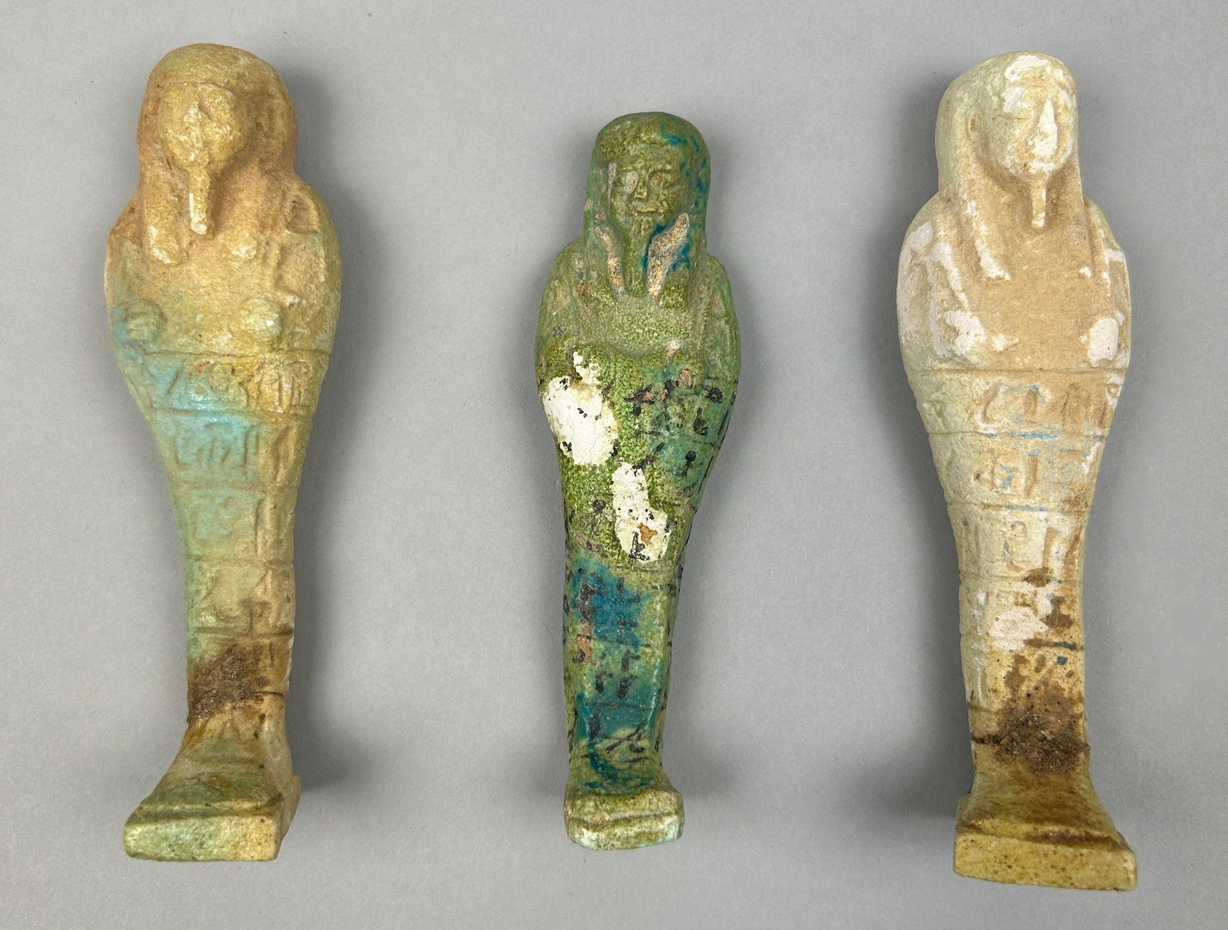 THREE EGYPTIAN GREEN FAIENCE SHABTI'S, possibly ancient.