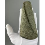 A NEOLITHIC AXE HEAD FROM SUFFOLK 15cm x 7cm