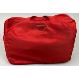 A PRADA RED NYLON BAG, with inner and outer zipped compartments 42cm x 30cm x 10cm
