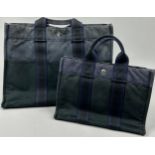 A SET OF TWO HERMES COTTON TOTE BAGS, purple and blue cotton with button clasp. 43cm x 30cm x 10cm