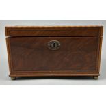 A GOOD REGENCY SHERATON DESIGN TEA CADDY, with rising lid veneered in figured mahogany. The interior