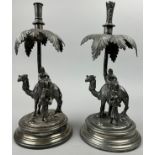 A MATCHED PAIR OF VICTORIAN SILVER PLATE CANDLESTICKS BY JAMES DEAKIN AND SONS, depicting camels and
