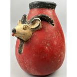 A PRE-COLUMBIAN STYLE JUG, modern after the antique with vivid red earthenware glaze and figure of a