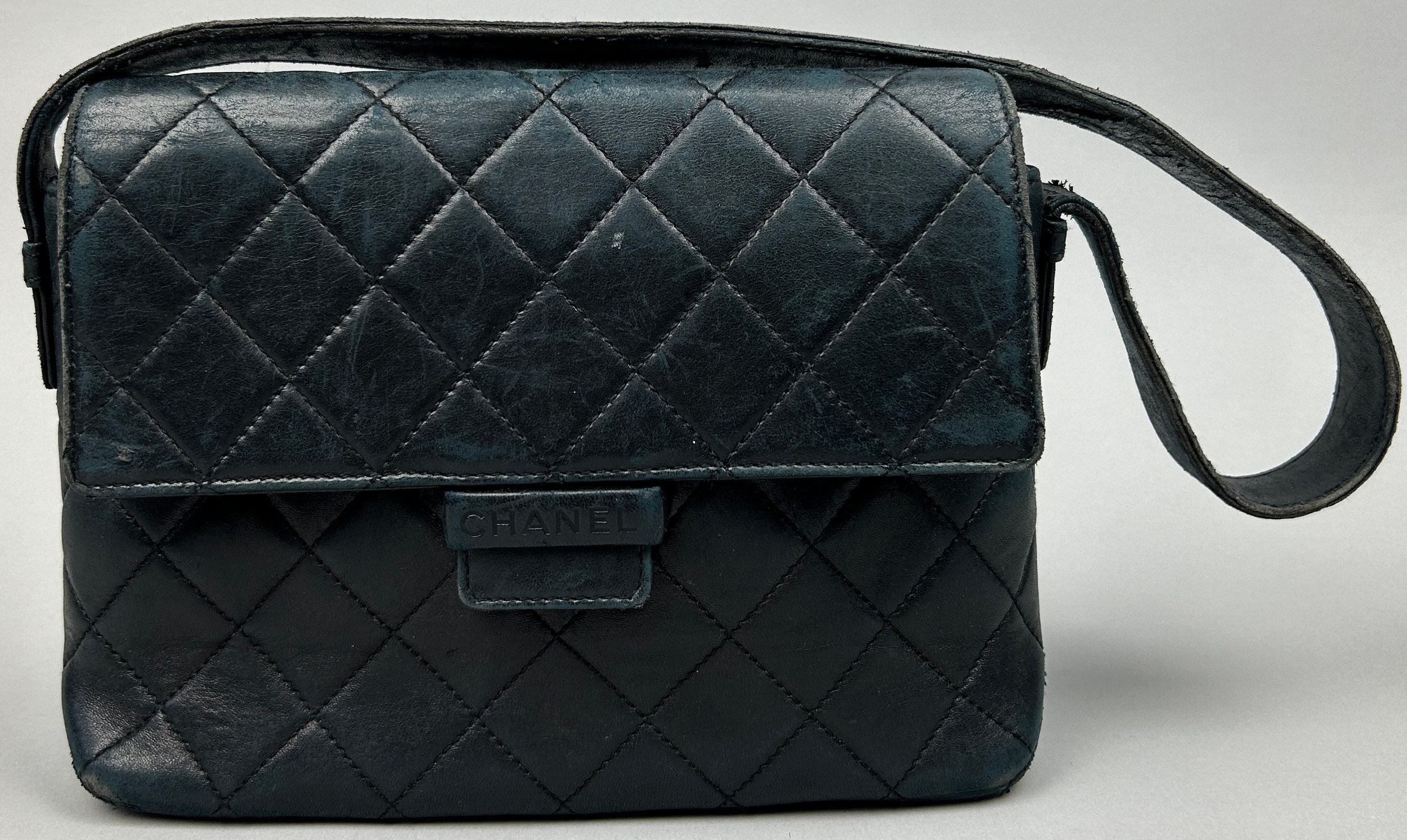 A CHANEL NAVY BLUE LEATHER QUILTED HANDBAG, with certificate of authenticity serial 10218184 and