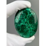 A LARGE POLISHED MALACHITE STONE FROM THE CONGO