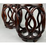 A PAIR OF CHINESE ROSEWOOD BARREL STOOLS, with burl inset circular top and reticulated sides, carved