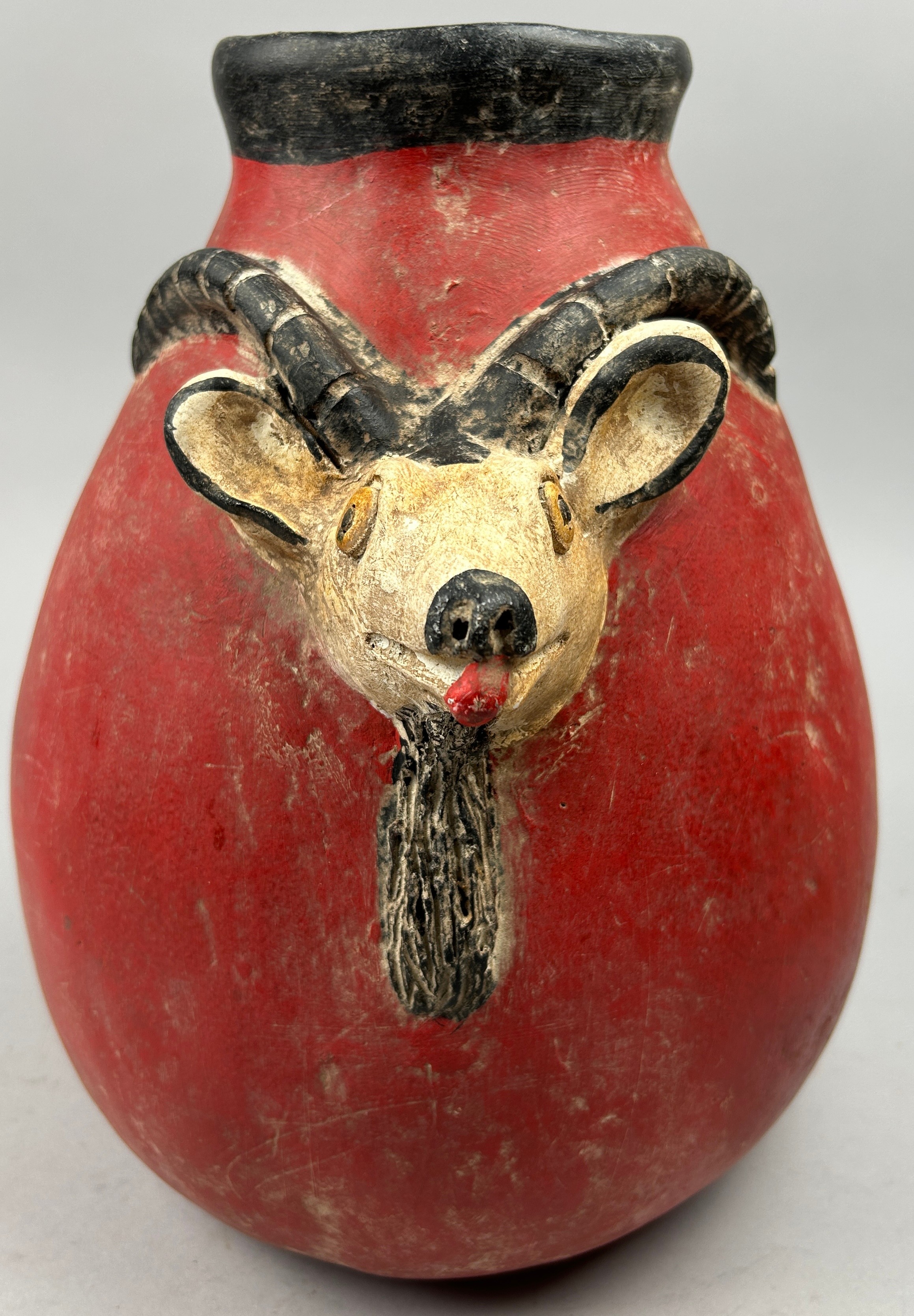 A PRE-COLUMBIAN STYLE JUG, modern after the antique with vivid red earthenware glaze and figure of a - Image 2 of 4