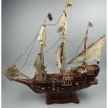 A LARGE WOODEN MODEL OF A SHIP