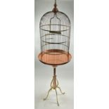 A BRASS BIRD CAGE ONCE BELONGING TO DERREN BROWN'S PARROT "RASPUTIN", BY JAMES DURANT. 215cm x