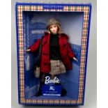 A BURBERRY LIMITED EDITION BLUE LABEL BARBIE, boxed in original packaging wearing a nova check hat