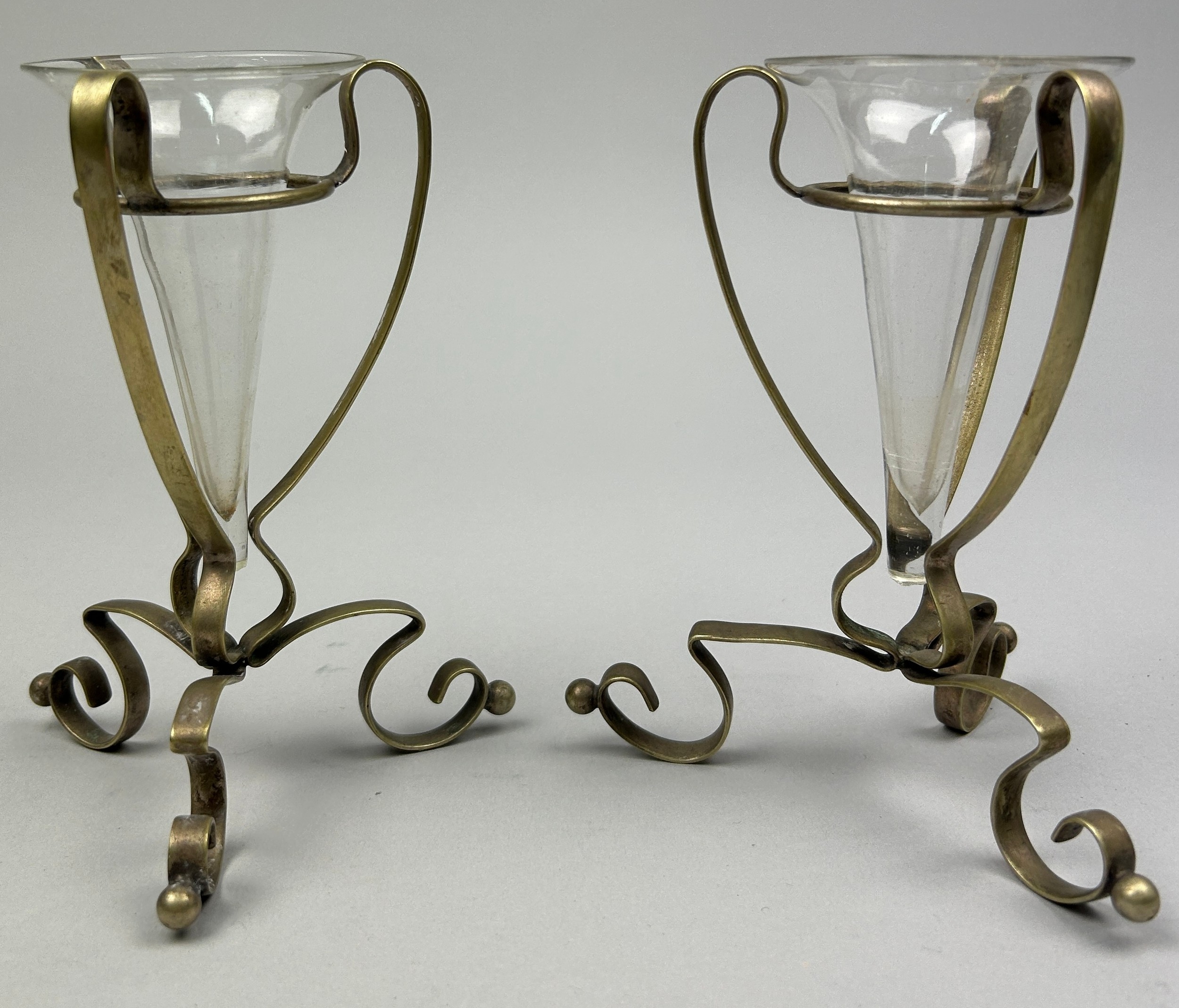 ATTRIBUTED TO WILLIAM ARTHUR SMITH BENSON (1854-1924), conical glasses in art nouveau brass stands