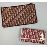 A CHRISTIAN DIOR CLUTCH BAG AND PURSE, both with Dior red and beige monogram (2) Stamped within.