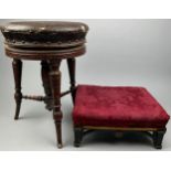 AN EDWARDIAN ROTATING BROWN LEATHER PIANO STOOL ON TURNED LEGS AND STRETCHERS, along with a