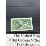 A KING GEORGE V £1 GREEN 'SEAHORSES' STAMP, mounted mint along with a penny black stamped with a