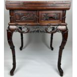 A CHINESE CARVED CENTRE TABLE WITH FAUX BAMBOO CRESTS,