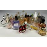 A COLLECTION OF PARTIALLY USED DESIGNER PERFUME BOTTLES, to include Chanel, Gucci, Moschino and more