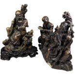 THREE CHINESE HARDSTONE FIGURES, depicting figures at worship. One mounted on a wooden base with