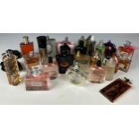 A COLLECTION OF PARTIALLY USED PERFUMES, to include Versace, Dior, Yves Saint Laurent, Givenchy