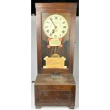 RAILWAYANA: A GLEDHILL-BROOK TIME RECORDER LTD CLOCK, in mahogany cased with glass fronted door.