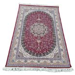 A LARGE PERSIAN DESIGN CARPET, Crafted in Turkey 225cm x 150cm