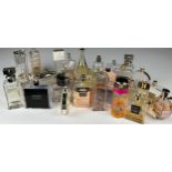 A COLLECTION OF PARTIALLY USED DESIGNER PERFUME BOTTLES, to include Chanel, Dior, Hugo Boss, Gucci