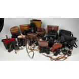 A GROUP OF BINOCULARS IN CASES, various names and makers (Qty)