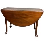 AN EARLY 19TH CENTURY MAHOGANY DROP LEAF TABLE, on four legs raised on pad feet. **Please note