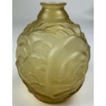 AN ART DECO GLASS VASE, opaque pressed glass with circular base.