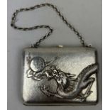 AN EARLY 20TH CENTURY CHINESE SILVER CIGARETTE CASE WITH RAISED DRAGON CHASING A FLAMING PEARL,
