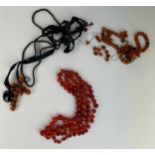 A COLLECTION OF AMBER BEADED NECKLACES, including one complete cherry amber necklace,