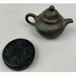 A CHINESE YIXING TEA POT WITH GREEN PAINTED BAMBOO AND CALLIGRAPHY, along with an iron ink box