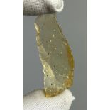 A NEOLITHIC SCRAPING TOOL IN DESERT GLASS TEKTITE, From the Tenerean Culture, tool was worked