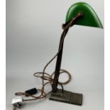 A LARGE BANKERS LAMP, green enamelled shade with iron stem and base 48cm in height.