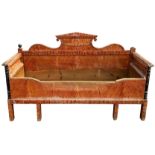 AN EMPIRE DESIGN SWEDISH PAINTED SCUMBLED PINE DAY BED, with carved crested pediment, ebonised