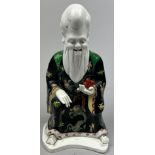 A TUSCAN WARE CHINESE 'KANG HE' FIGURE OF AN IMMORTAL, painted ceramic.