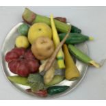 A COLLECTION OF ANTIQUE WAX VEGETABLES ON A PEWTER PLATE (17)