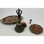 A LARGE BRASS BELL, with a god and sceptre along with two carved wood dishes, a small brass figure