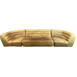 A TIMOTHY OULTON SECTIONAL CORNER SOFA, brown tan leather. 435cm x 125cm x 75cm Condition is overall