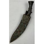 AN ISLAMIC KUKRI IN SHEATH DECORATED WITH CABACHONS, with two smaller articles.
