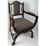 A GLASTONBURY STYLE X FRAME ARMCHAIR, upholstered in damask fabric. 86cm x 54cm