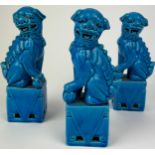 A SET OF THREE CHINESE DOG OF FOO, blue glazed ceramic (3) 21cm H each
