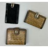 A SELECTION OF THREE VINTAGE FENDI WALLETS, two brown and one black all with interlocking 'FF'