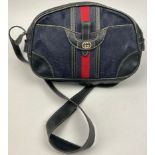 A GUCCI SIDE BAG IN NAVY BLUE WITH INTERLOCKING MONOGRAM EMBLEM AND LEATHER STRAP 32cm x 23cm Good