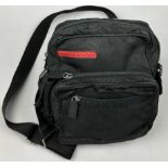 A PRADA SPORT BLACK NYLON SIDE BAG POUCH, with red strip logo and various zipped compartments 26cm x