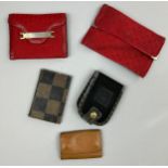 A SELECTION OF FIVE VINTAGE FENDI WALLETS AND ACCESSORIES, to include two red, one brown vanity set,