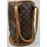 A LOUIS VUITTON BUCKET BAG, brown and tan leather with two buckled straps and LV monogram
