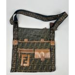 A FENDI SIDE BAG, with tan leather details and 'Zucca print' interlocking 'FF' emblems throughout.