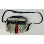 A VINTAGE GUCCI HANDBAG, with blue leather detail and strap. 25cm x 21cm Good condition, minimal